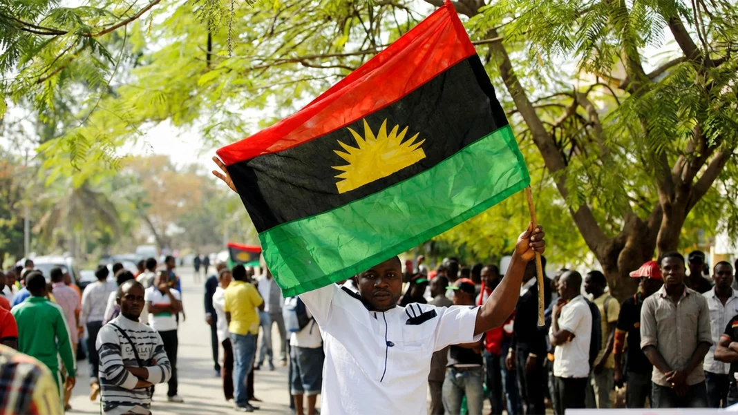A-supporter-of-Indigenous-People-of-Biafra-IPOB-leader-Nnamdi-Kanu-holds-a-Biafra-flag-during-a-rally-in-support-of-Kanu